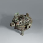 An Archaic Bronze Ritual Covered Tripod Pouring Vessel (Yi Ding)