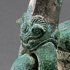 An Archaic Bronze Ritual Covered Tripod Wine Vessel (He)