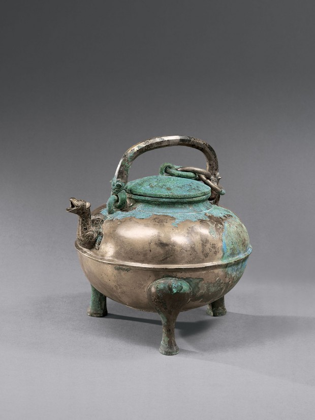 An Archaic Bronze Ritual Covered Tripod Wine Vessel (He)