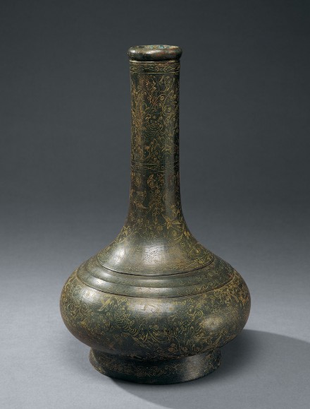 AN ARCHAIC BRONZE VASE WITH INCISED DECORATION