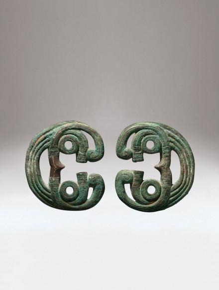 A PAIR OF ARCHAIC BRONZE HORSE BRIDLE ORNAMENTS / J.J. Lally & Co.,  Oriental Art / New York City, New York