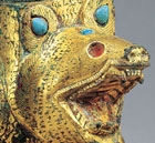 AN INLAID GILT BRONZE BEAR