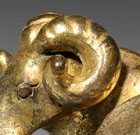 A GILT BRONZE RAM-FORM WEIGHT