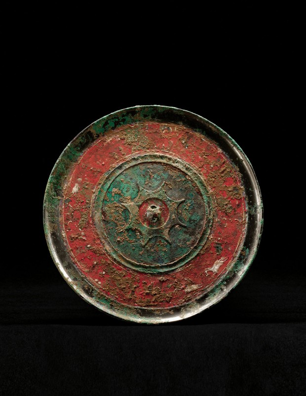 A PAINTED BRONZE MIRROR