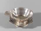 A PARCEL-GILT SILVER POURING BOWL AND STAND