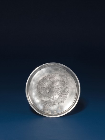 A SILVER DISH WITH CHASED FOLIATE DECORATION