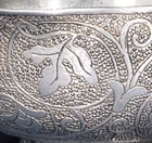 A PAIR OF SMALL CHASED SILVER CUPS