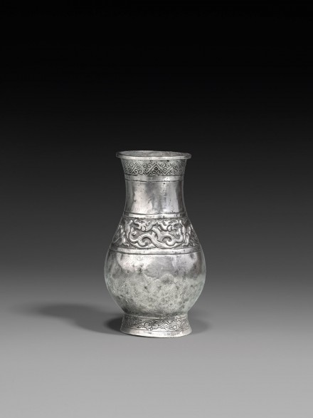 A SILVER VASE WITH DRAGON FRIEZE