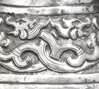 A SILVER VASE WITH DRAGON FRIEZE