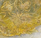 A PAIR OF CHASED AND PARCEL-GILT SILVER DISHES