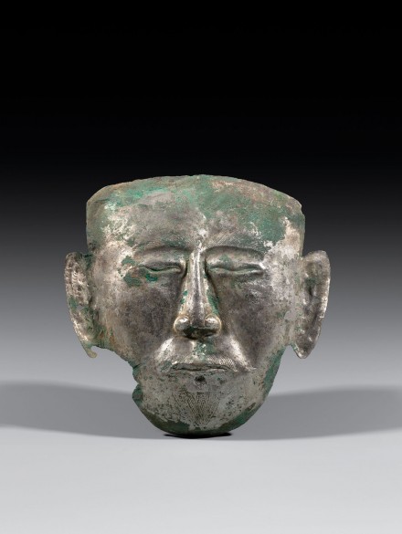 A CHASED SILVER FUNERARY MASK