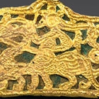 AN OPENWORK GOLD PLAQUE