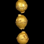 A SET OF EARLY GOLD HEADDRESS ORNAMENTS