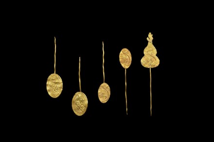 FIVE GOLD HAIR ORNAMENTS
