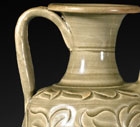 A CARVED YAOZHOU CELADON EWER