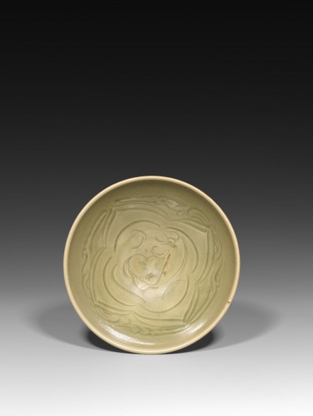 A CARVED YAOZHOU CELADON ‘XINIU GAZING AT THE MOON’ BOWL