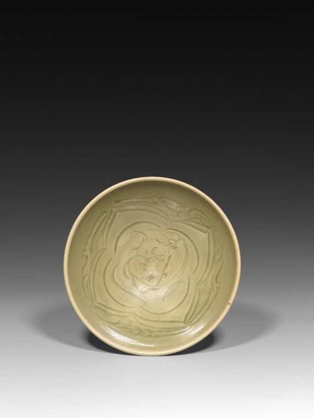 A CARVED YAOZHOU CELADON ‘XINIU GAZING AT THE MOON’ BOWL