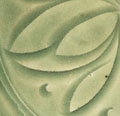 A CARVED YAOZHOU CELADON DEEP BOWL