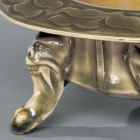 A CARVED YAOZHOU CELADON INCENSE BURNER ON ‘MONSTER-MASK’ LEGS