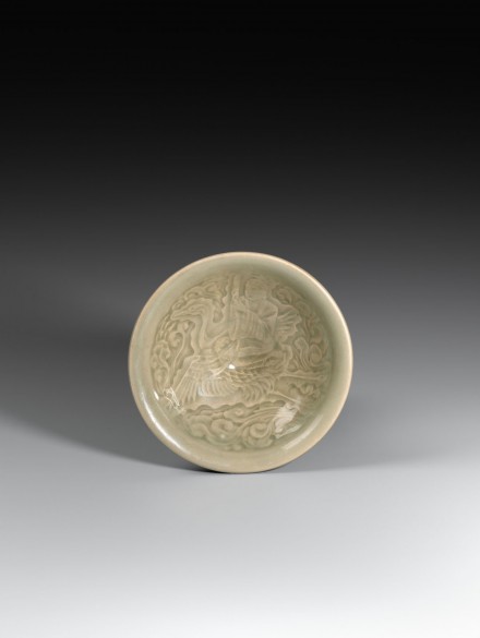 A YAOZHOU CELADON BOWL MOULDED WITH A DAOIST IMMORTAL