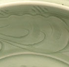 A LARGE CARVED LONGQUAN CELADON DISH