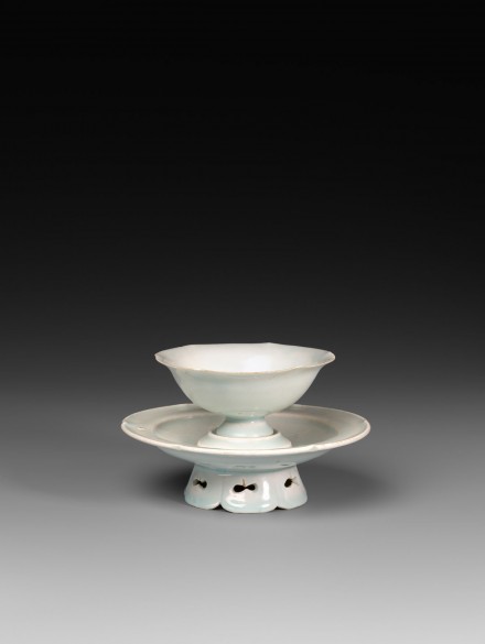 A YINGQING GLAZED PORCELAIN FLOWER-SHAPED WINECUP AND STAND