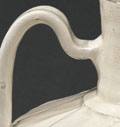 A WHITE-GLAZED CIZHOU POTTERY LOTUS-PETAL CARVED EWER