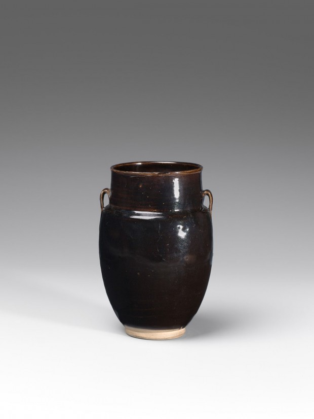 A BLACK-GLAZED STONEWARE JAR