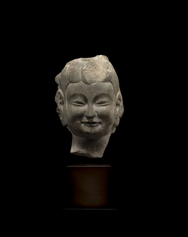 A GRAY LIMESTONE RELIEF HEAD OF A BODHISATTVA