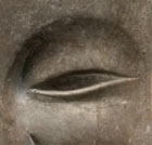 A GRAY LIMESTONE RELIEF HEAD OF A BODHISATTVA