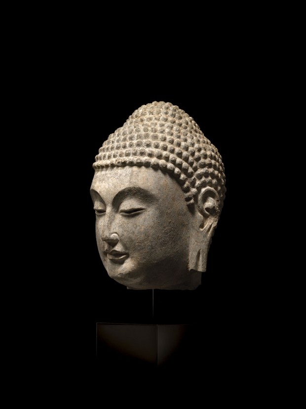 A GRAY LIMESTONE HEAD OF BUDDHA