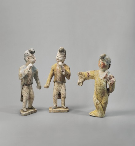 A GROUP OF PAINTED POTTERY DANCING FIGURES
