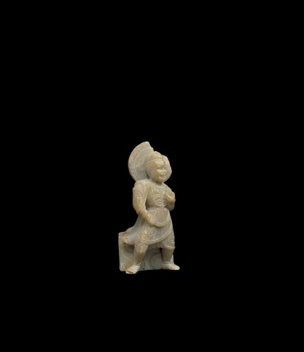 AN EARLY CARVED STEATITE FIGURE OF A LOKAPALA