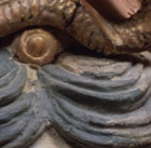 A LARGE PAINTED AND GILDED STUCCO HEAD OF A BODHISATTVA