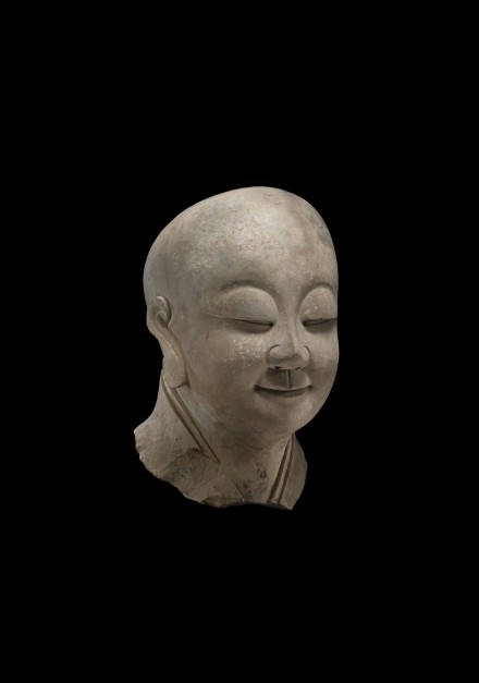 A SANDSTONE HEAD OF A BUDDHIST DISCIPLE