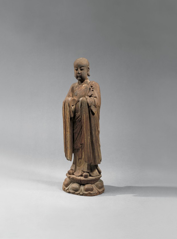 A WOOD FIGURE OF A BUDDHIST MONK