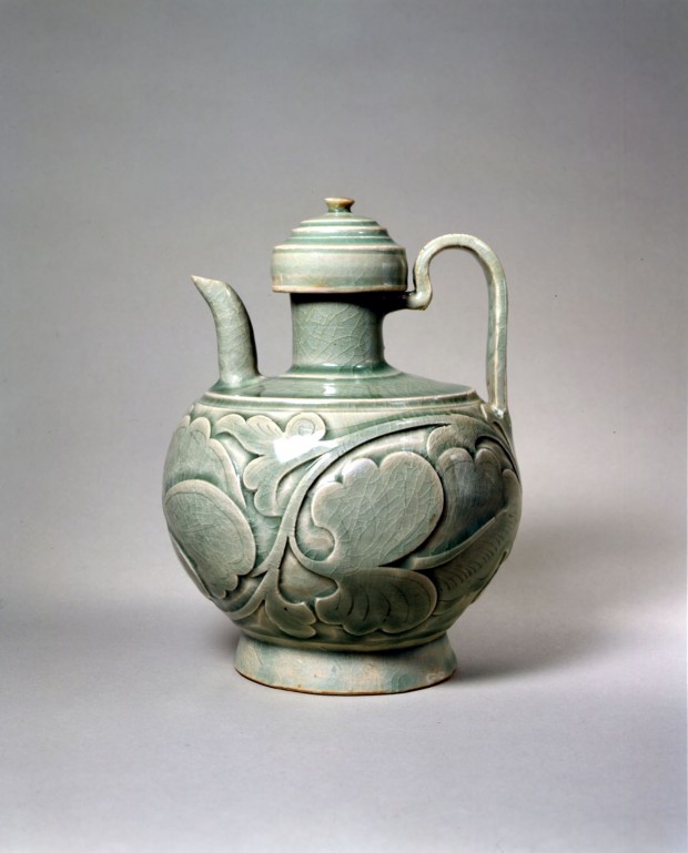 AN EARLY CARVED YAOZHOU CELADON EWER AND COVER