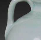 A QINGBAI GLAZED PORCELAIN EWER AND COVER