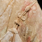 A PAINTED WHITE MARBLE TORSO OF THE BUDDHA