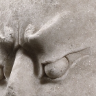 A WHITE MARBLE HEAD OF A BUDDHIST GUARDIAN (DVÁRAPÁLA)