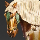 A SANCAI-GLAZED POTTERY FIGURE OF A SADDLED HORSE