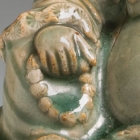 A LONGQUAN CELADON GLAZED STONEWARE FIGURE OF BUDAI