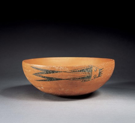 A NEOLITHIC RED POTTERY BOWL WITH PAINTED FISH DESIGN