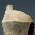 A TALL NEOLITHIC POTTERY TRIPOD EWER