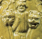 A GLAZED POTTERY FLASK MOULDED WITH ‘FOREIGNERS’ AND LIONS