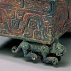 AN ARCHAIC BRONZE BOX ON WHEELED TIGERS