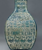 A LARGE ARCHAIC BRONZE WINE JAR WITH PICTORIAL DECORATION (FANGHU)