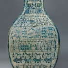 A LARGE ARCHAIC BRONZE WINE JAR WITH PICTORIAL DECORATION (FANGHU)