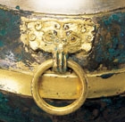 A GILDED AND SILVERED BRONZE COVERED VESSEL (HU)