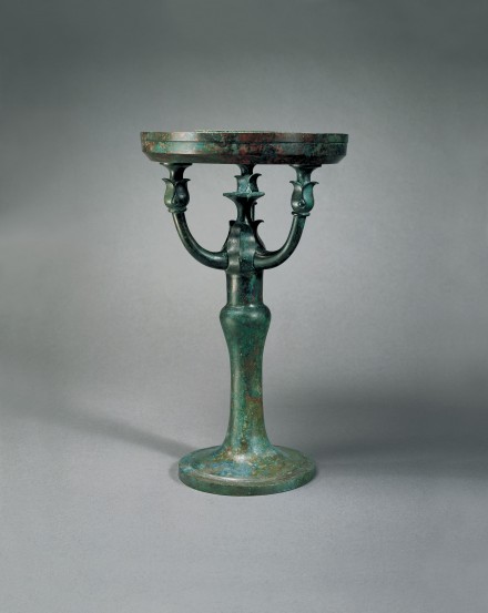 AN ARCHAIC BRONZE LAMP